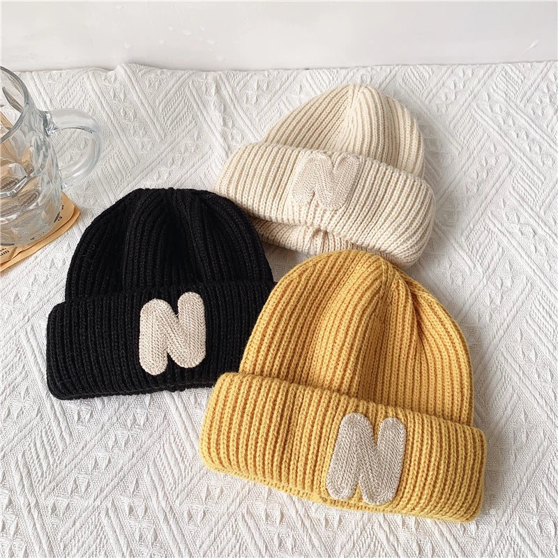 ins Children's hats Autumn/Winter N letter stick cloth knitted hats for boys and girls cute warm bun wool hat trend